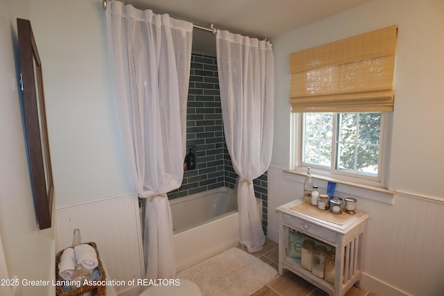 1615 Peppertree Ln, Lansing, MI 48912 - full bath with wainscoting, shower / bath combo with shower curtain, and tile patterned flooring