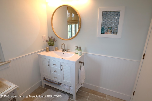 1615 Peppertree Ln, Lansing, MI 48912 - bathroom featuring wainscoting, vanity, and tile patterned floors