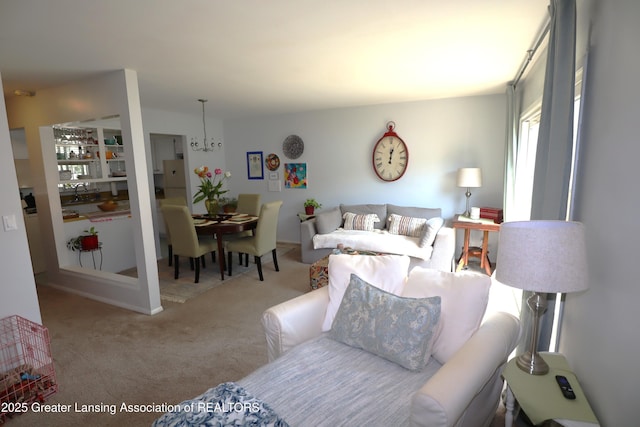 1615 Peppertree Ln, Lansing, MI 48912 - living room with a chandelier and carpet