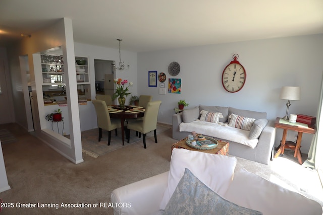1615 Peppertree Ln, Lansing, MI 48912 - carpeted living room featuring a chandelier