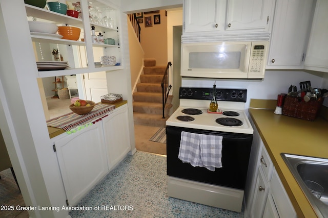 1615 Peppertree Ln, Lansing, MI 48912 - kitchen with range with electric stovetop, white microwave, white cabinetry, a sink, and open shelves