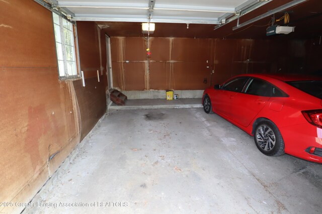 1615 Peppertree Ln, Lansing, MI 48912 - garage featuring a garage door opener