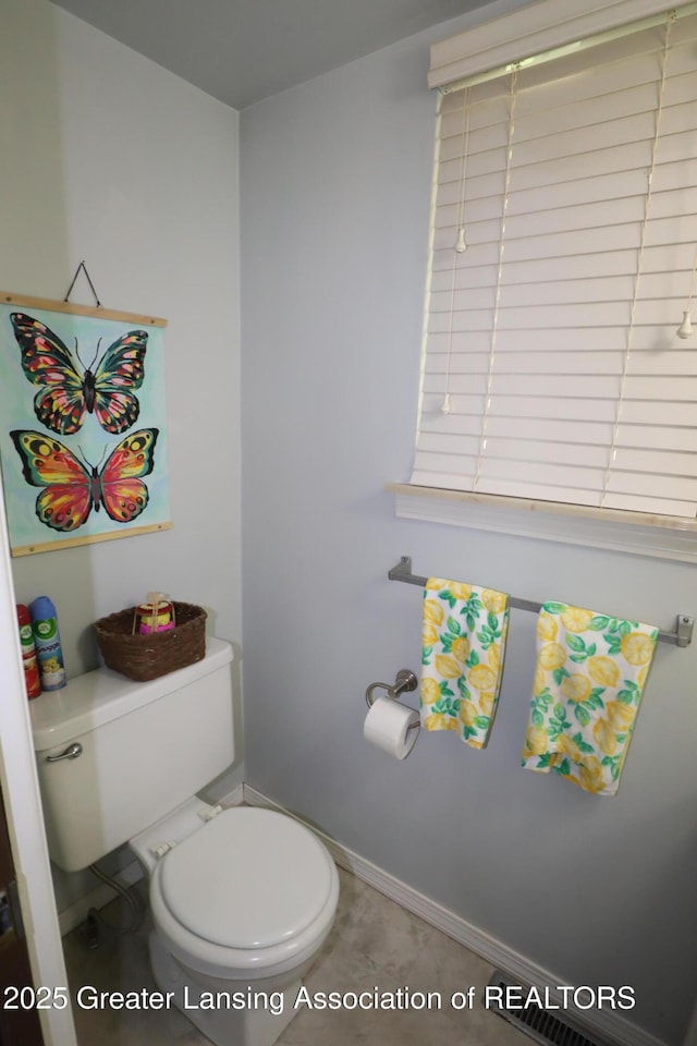 1615 Peppertree Ln, Lansing, MI 48912 - bathroom with toilet and baseboards