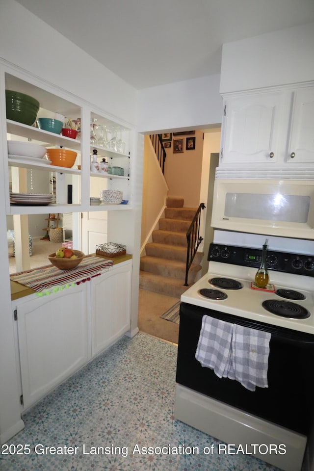 1615 Peppertree Ln, Lansing, MI 48912 - kitchen with white appliances, white cabinets, and open shelves