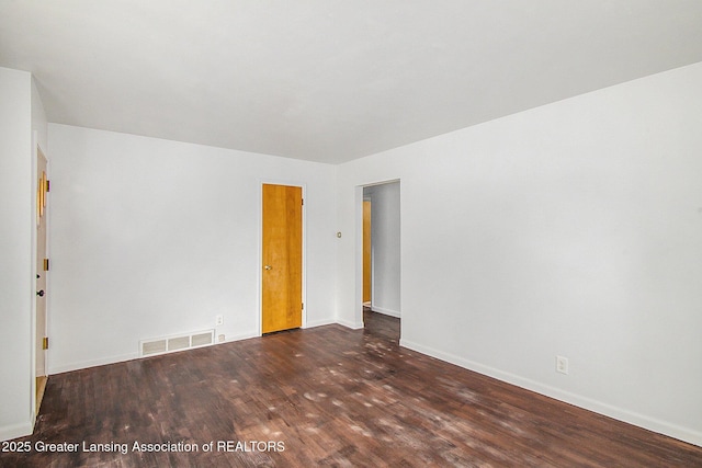 4512 Alpha St, Lansing, MI 48910 - spare room with wood finished floors and baseboards