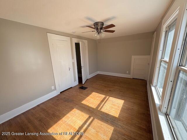 1305 W Hillsdale St, Lansing, MI 48915 - empty room featuring baseboards, wood finished floors, and a ceiling fan