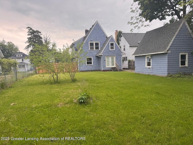 1305 W Hillsdale St, Lansing, MI 48915 - view of front of house featuring entry steps and a chimney