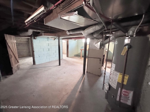1305 W Hillsdale St, Lansing, MI 48915 - unfinished below grade area featuring gas water heater and heating unit
