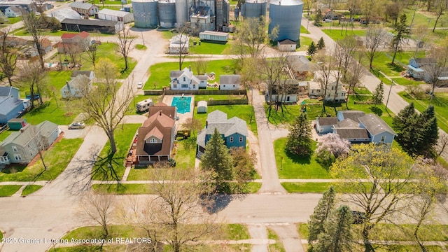 309 W Plain St, Eaton Rapids, MI 48827 - aerial perspective of suburban area with a pool area
