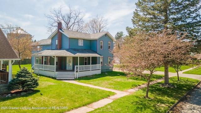 309 W Plain St, Eaton Rapids, MI 48827 - view of front of house with covered porch, a front yard, and a shingled roof