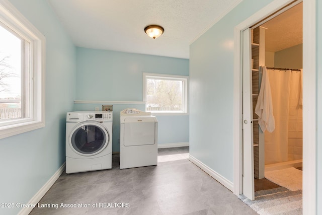 309 W Plain St, Eaton Rapids, MI 48827 - washroom with washing machine and clothes dryer and baseboards