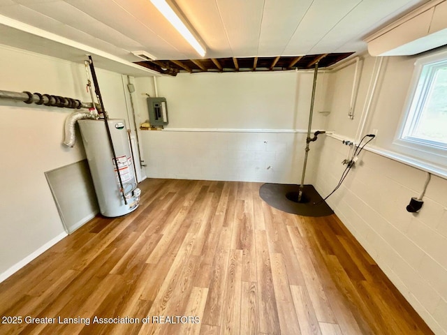 4408 Arbor Dr, Okemos, MI 48864 - basement featuring water heater, electric panel, and wood finished floors