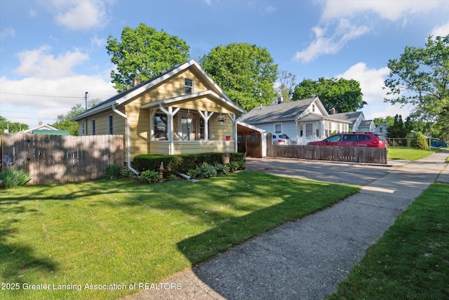 3804 Glenwood Ave, Lansing, MI 48910 - bungalow-style house with driveway and a chimney