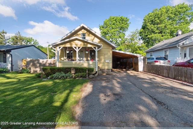 3804 Glenwood Ave, Lansing, MI 48910 - view of front of property with driveway, a carport, and covered porch