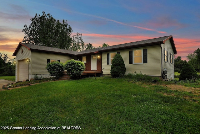 3115 Dietz Rd, Williamston, MI 48895 - single story home featuring an attached garage, a lawn, and concrete driveway