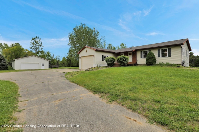 3115 Dietz Rd, Williamston, MI 48895 - ranch-style home with a garage and a front yard
