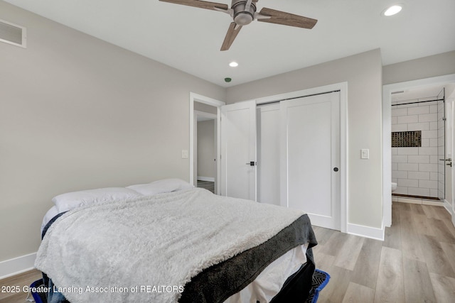 3115 Dietz Rd, Williamston, MI 48895 - bedroom with light wood-style flooring, a closet, recessed lighting, and baseboards