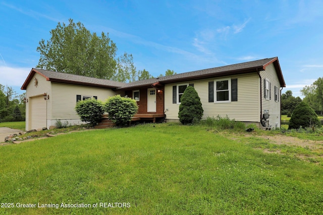 3115 Dietz Rd, Williamston, MI 48895 - ranch-style home with an attached garage, a front yard, and driveway