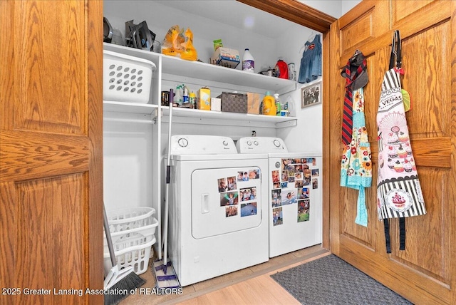 4582 N Watson Rd, Elsie, MI 48831 - laundry area with independent washer and dryer and wood finished floors