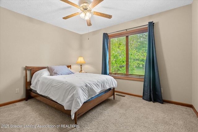 4582 N Watson Rd, Elsie, MI 48831 - bedroom with baseboards, carpet, and ceiling fan