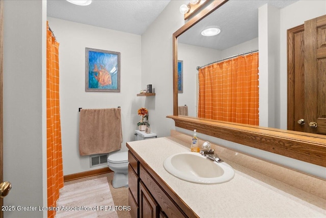 4582 N Watson Rd, Elsie, MI 48831 - full bathroom with toilet, vanity, baseboards, and a shower with shower curtain