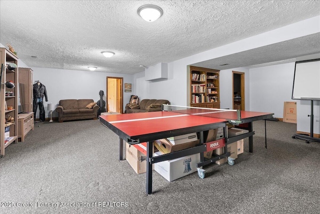 4582 N Watson Rd, Elsie, MI 48831 - recreation room featuring a textured ceiling and carpet