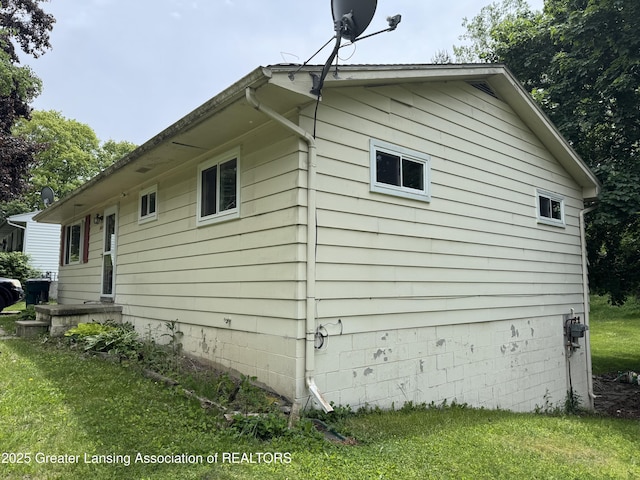 3425 Cooley Dr, Lansing, MI 48911 - view of property exterior featuring a yard