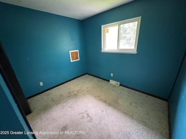 3425 Cooley Dr, Lansing, MI 48911 - unfurnished room featuring carpet and baseboards