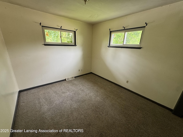 3425 Cooley Dr, Lansing, MI 48911 - empty room with baseboards and carpet flooring