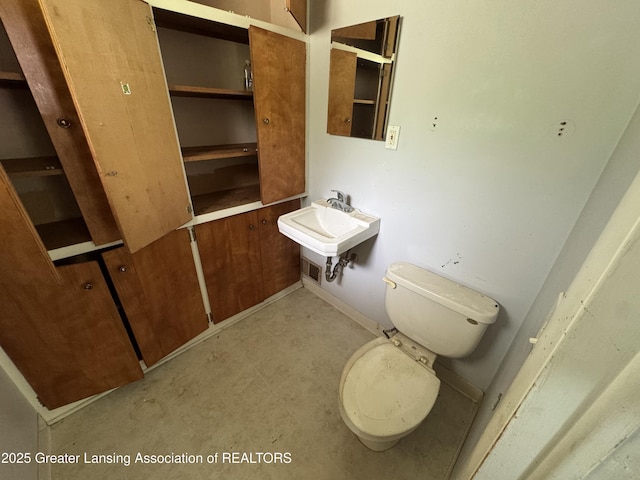 3425 Cooley Dr, Lansing, MI 48911 - half bathroom featuring toilet and a sink