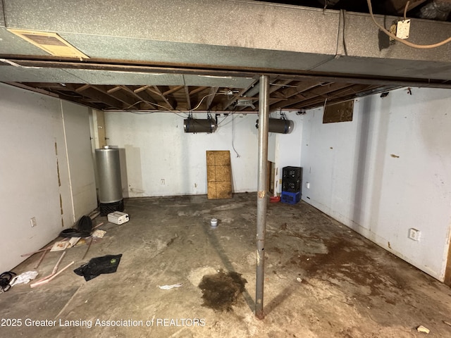 3425 Cooley Dr, Lansing, MI 48911 - unfinished basement with water heater