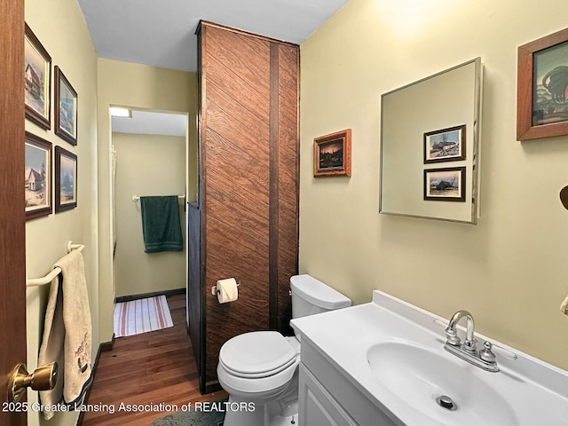 2623 Timberlane Trl, Grayling, MI 49738 - full bathroom with wood finished floors, vanity, and toilet