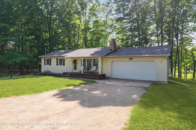 248 Gale Rd, Mason, MI 48854 - single story home featuring concrete driveway, a porch, a chimney, a front yard, and an attached garage