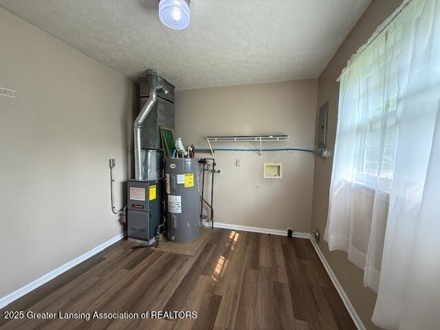 207 Wight St Unit 209, Elsie, MI 48831 - utilities with water heater, heating unit, and electric panel