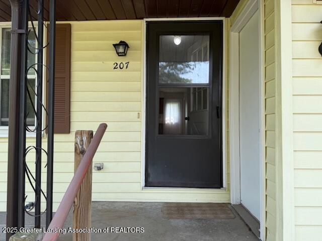 207 Wight St Unit 209, Elsie, MI 48831 - doorway to property with covered porch