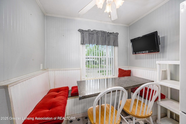 18762 Woodland St, Harper Woods, MI 48225 - dining space featuring ornamental molding, breakfast area, a ceiling fan, and wainscoting