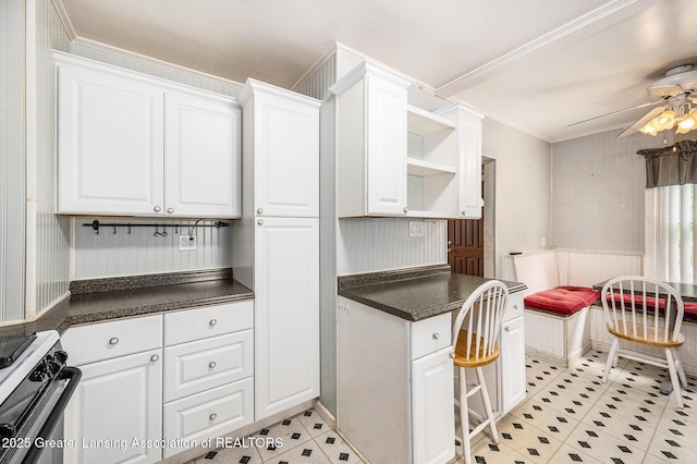 18762 Woodland St, Harper Woods, MI 48225 - kitchen with range with gas cooktop, dark countertops, white cabinetry, open shelves, and light tile patterned floors