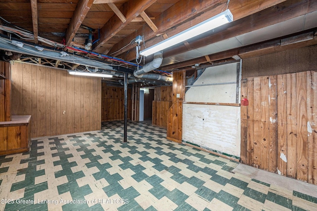 18762 Woodland St, Harper Woods, MI 48225 - below grade area with tile patterned floors and wood walls