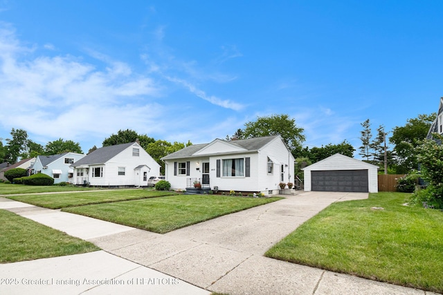 4415 Devonshire Ave, Lansing, MI 48910 - bungalow-style house with an outdoor structure, a garage, and a front yard