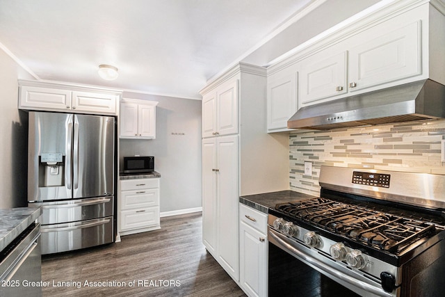 4415 Devonshire Ave, Lansing, MI 48910 - kitchen with appliances with stainless steel finishes, under cabinet range hood, white cabinets, backsplash, and ornamental molding