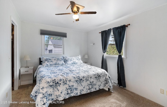 4415 Devonshire Ave, Lansing, MI 48910 - carpeted bedroom with a ceiling fan