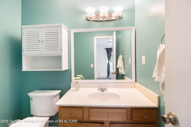 4415 Devonshire Ave, Lansing, MI 48910 - bathroom with vanity and toilet