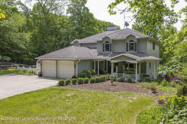 11781 W Herbison Rd, Eagle, MI 48822 - view of front of home with a porch, a garage, concrete driveway, a chimney, and roof with shingles