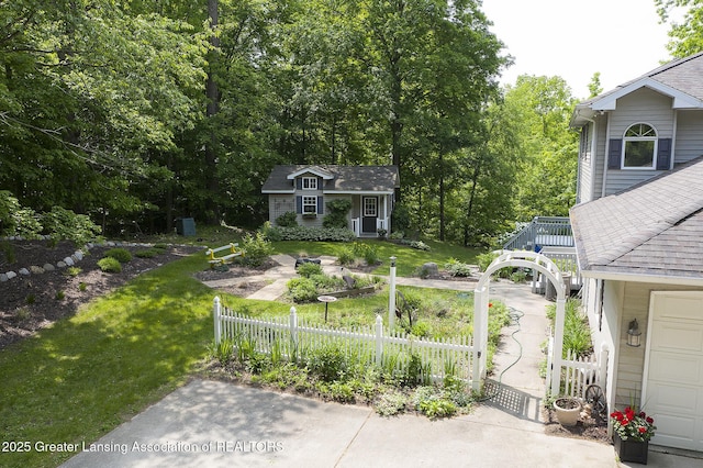11781 W Herbison Rd, Eagle, MI 48822 - view of yard featuring an outbuilding and a deck