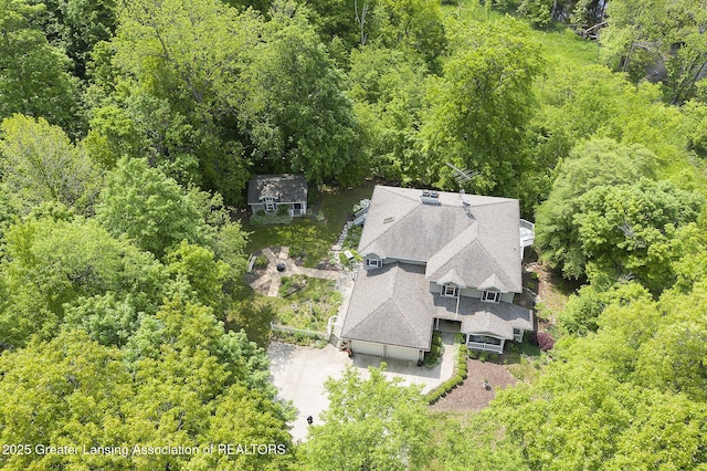 11781 W Herbison Rd, Eagle, MI 48822 - view of subject property featuring a heavily wooded area