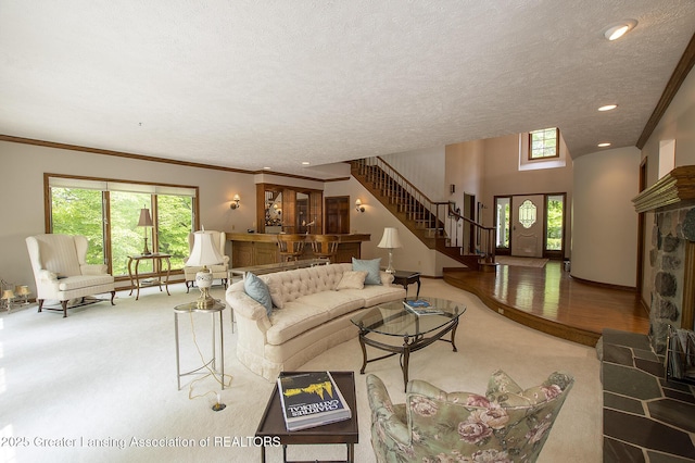 11781 W Herbison Rd, Eagle, MI 48822 - carpeted living area featuring stairs, a textured ceiling, recessed lighting, and crown molding