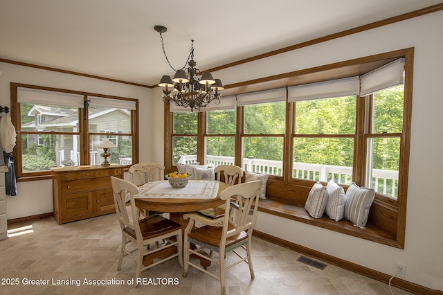 11781 W Herbison Rd, Eagle, MI 48822 - dining room with baseboards, healthy amount of natural light, a chandelier, and ornamental molding