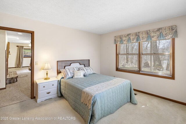 11781 W Herbison Rd, Eagle, MI 48822 - bedroom featuring light carpet and baseboards