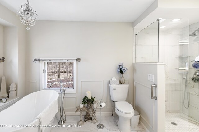 11781 W Herbison Rd, Eagle, MI 48822 - bathroom featuring a soaking tub, a stall shower, toilet, and baseboards