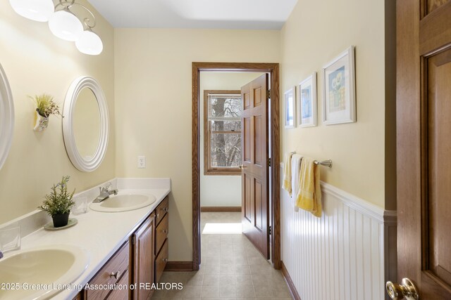 11781 W Herbison Rd, Eagle, MI 48822 - full bath featuring double vanity and tile patterned floors